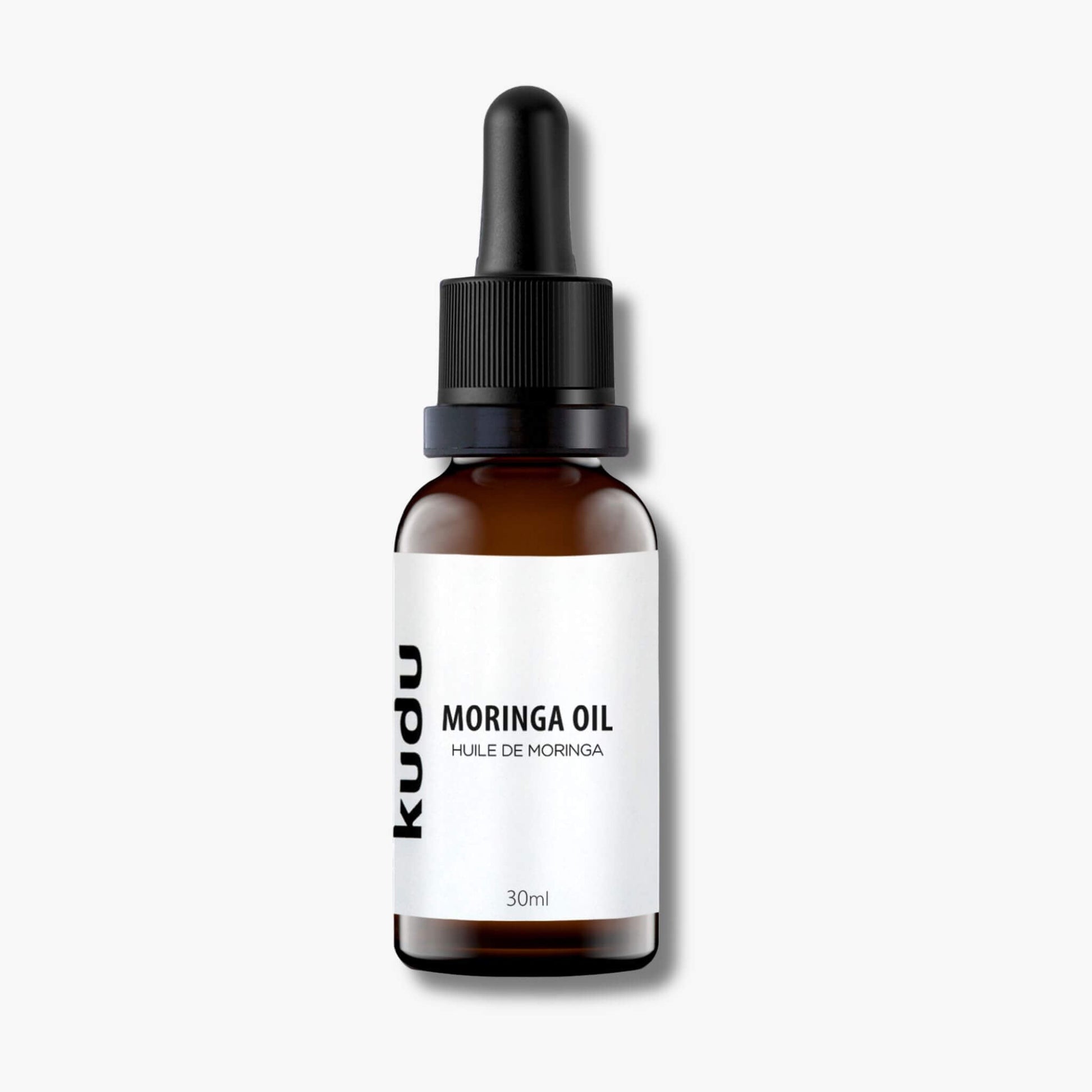 A bottle of Kudu Cosmetica moringa oil on a plain background