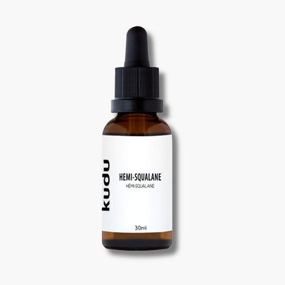 A dropper bottle of Kudu Cosmetica Hemi Squalane on a plain bbackground.
