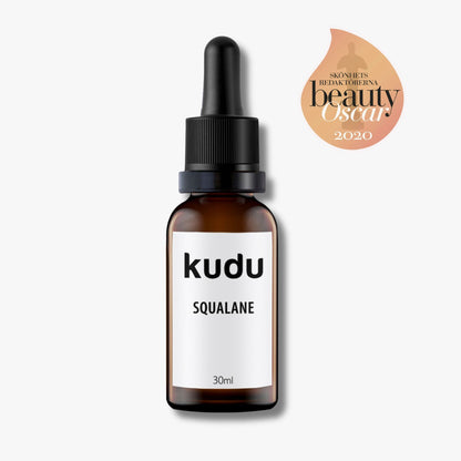A bottle of Kudu Cosmetica  award winning Squalane oil on a plain background