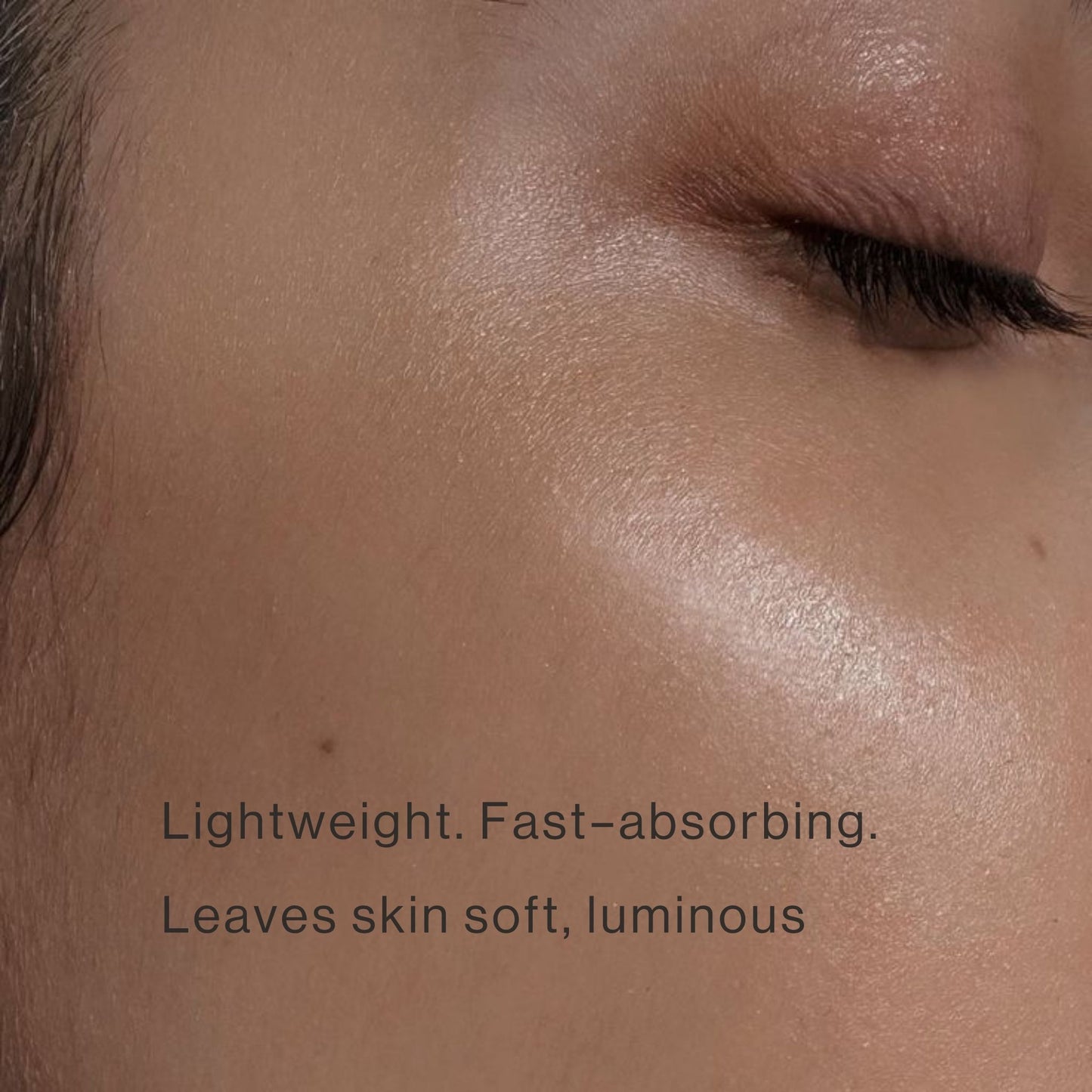 Close-up of glowing skin showing lightweight facial oil absorbtion, soft luminous finish.